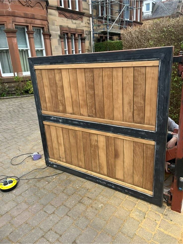 Gate panel sanded and stained on site