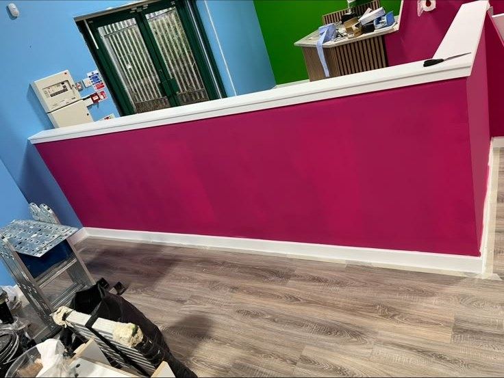 Reception counter painted deep pink