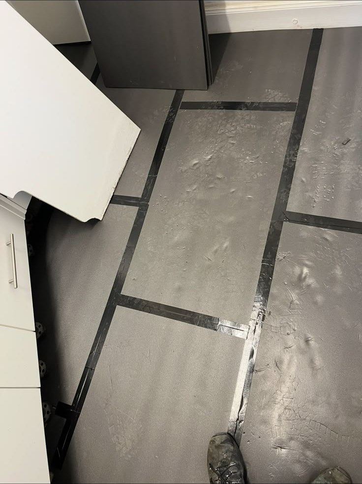 Floor prep underway before covering goes down