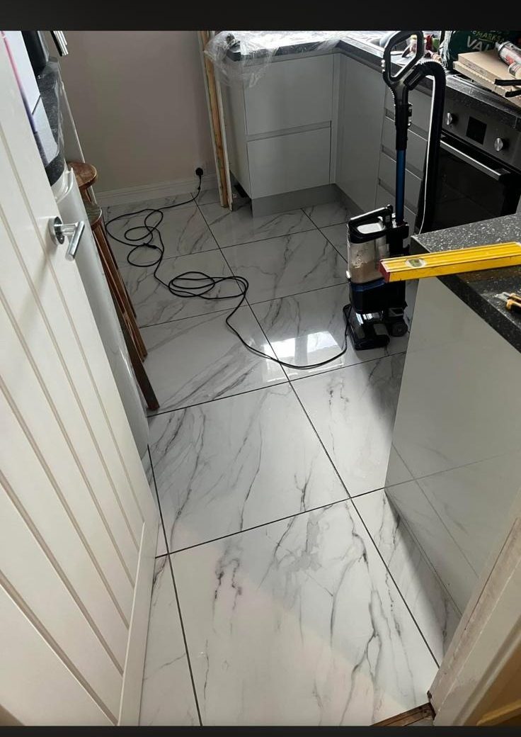 Porcelain floor tiling finished in a kitchen